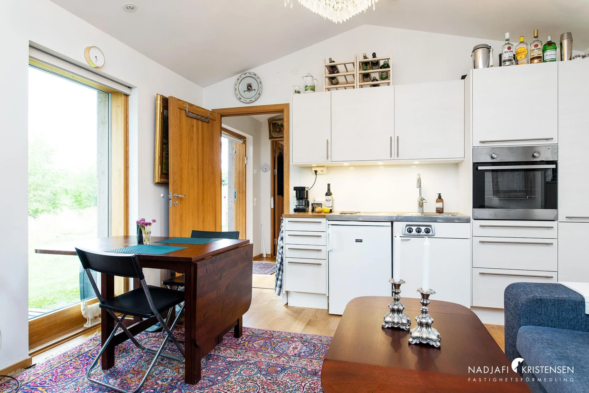 The kitchen with dining table and view