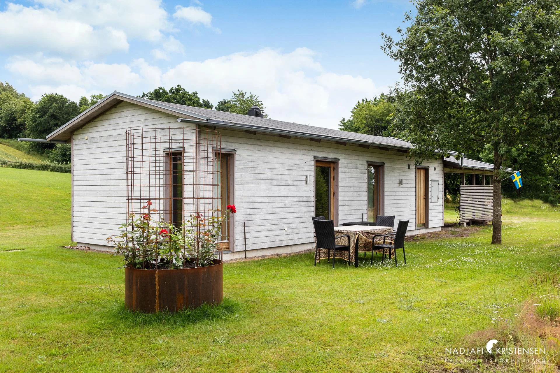 The house with outdoor seating in the garden